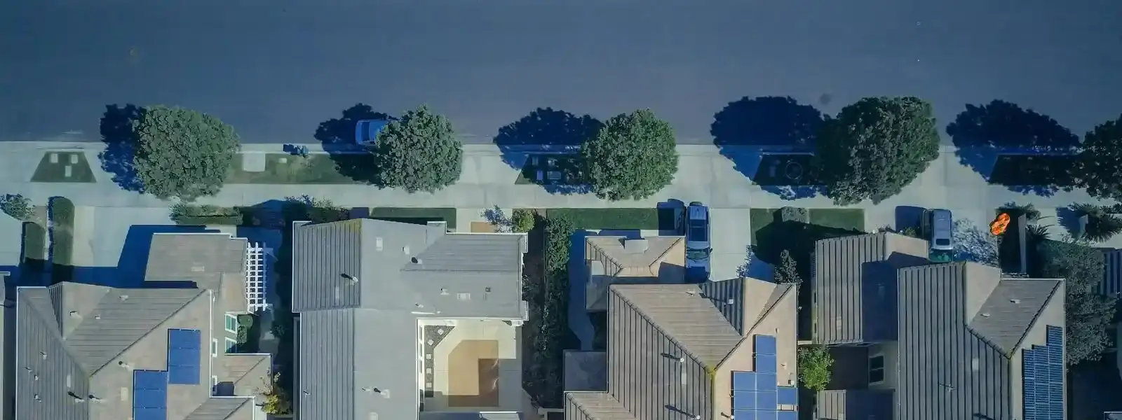 aerial view of houses with solar panels
